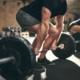 The evidence is good for the use of free weights, although machines can also do the trick.