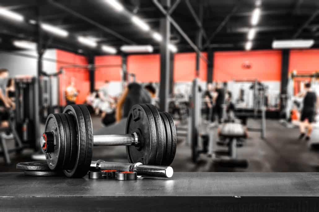 Free Weights vs. Machines: 8 Benefits, Form Tips, Weights, and More